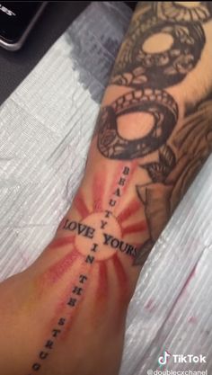 a person with a tattoo on their arm that says, love your inner and outer