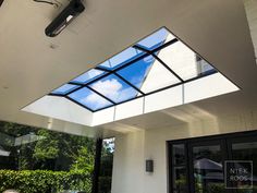 the skylight is open to let in light on the house's patio area