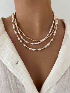 Add this with any stack for some added style or wear it alone for a classy look Made with freshwater pearls & 14k gold filled beads 15 inches with 2 inch extender Gold Beaded Pearl Layered Necklace, Gold Pearl Beaded Layered Necklace, Gold Pearl Beaded Necklace Single Strand, Adjustable Pearl Necklaces With Gold Beads, Adjustable Pearl Necklace With Gold Beads, Elegant Beaded Necklaces With 14k Gold Filled Beads, Elegant 14k Gold-filled Beaded Necklaces, Adjustable Gold Pearl Beaded Necklaces, Necklaces With Pearls