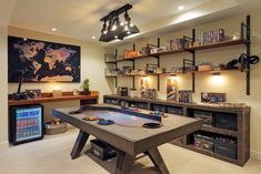 a game room with a large table and shelves