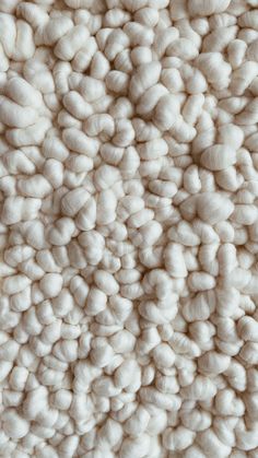 the texture of wool is white and fluffy