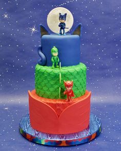 a three tiered cake with an image of the cat in the hat on top