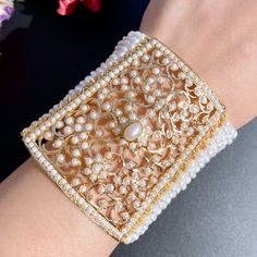 Featuring a traditional punjabi jadau bracelet for women in 22ct gold. It has been embellished with precious freshwater pearls. A contemporary design with timeless appeal, this bracelet is a modern classic that will outlast any fashion trend. Enjoy the comfort of high-quality 22ct gold and the beauty of lustrous freshwater pearls. The bracelet weighs 45.04 GMs including 20.05 GMs of stringing pearls Watch Product Video Clip Price Breakup Summary Component Rupees % of Total 22k Gold 118,866 70.0% Bengali Design, Jadau Bracelet, Stringing Pearls, 22k Gold Jewelry Necklaces, 22k Gold Bracelet, 22k Gold Jewelry, Pearl Bracelets, Jewellery Indian, Pearl Necklace Set