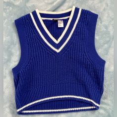 Size Xs Never Worn 100% Acrylic Blue And White Trendy Blue Sleeveless Sweater, Trendy Sleeveless Blue Sweater, Trendy Fitted Blue Sweater Vest, Blue Fitted Sweater Vest For Spring, Fitted Blue Sweater Vest For Spring, Casual Blue Sweater Vest For Spring, Trendy Blue H&m Tops, Blue Knit Vest, School Minimalist