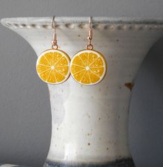 "-Materials : 26mmX23mm enamel orange charm -size: 1.25\" dangling -gold plated earring hooks - nickel, lead free!" Orange Slice, Lemon Slice, Orange Slices, Earring Hooks, Gold Plated Earrings, Tassel Earrings, Charm Earrings, Jewelry Earrings Dangle, Hippie Boho