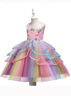 Infused with the magic of a fairy tale, this girl's dress is a cascade of pastel tulle, adorned with a garden of fabric flowers. The bodice is a canvas for intricate floral designs, inviting close admiration. The full skirt, featuring a spectrum of gentle colors, is ready for any festive spin or enchanting entrance. This dress is a delightful choice for any young girl attending a formal event, participating in a pageant, or celebrating a milestone. US Length (inches) Bust size (inches) 3-4Y 23.6 Spring Fairytale Fairy Dress For Dress-up, Multicolor Fairy Dress For Dress-up, Whimsical Rainbow Princess Dress For Dress-up, Princess Style Pink Fairy Dress With Floral Applique, Whimsical Princess Dress With Ruffles For Spring, Whimsical Pink Princess Dress For Garden Party, Whimsical Spring Princess Dress With Ruffles, Whimsical Tulle Tutu Dress For Garden Party, Spring Fairy Princess Dress For Dress-up