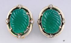 Presented is a lovely pair of 14 karat gold, diamond and chrome chalcedony earrings. These are relatively modern earrings, likely of American make. The earrings are set with oval pieces of chrome chalcedony in a rich green color, with a domed, swirled design. At the four cardinal points around each earring is a sparkling diamond, contrasting with the green and gold beautifully. The earrings have clip backs with a retractable post, so they can be converted for wear with both pierced and unpierced Oval Art Deco Earrings For Formal Occasions, Art Deco Oval Earrings For Formal Occasions, Formal Oval Art Deco Earrings, Elegant Green Oval Clip-on Earrings, Cardinal Points, Chalcedony Earrings, Marcasite Ring, Green Chalcedony, Locket Pendant Necklace