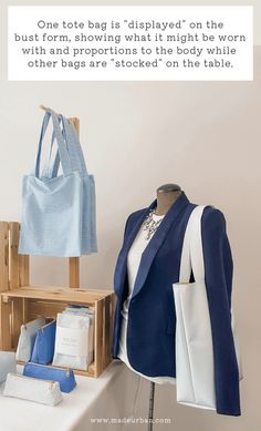 a blue and white jacket sitting on top of a wooden table next to a bag