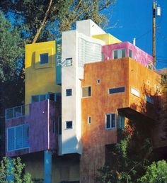 an image of a house that looks like it has been painted pink and yellow