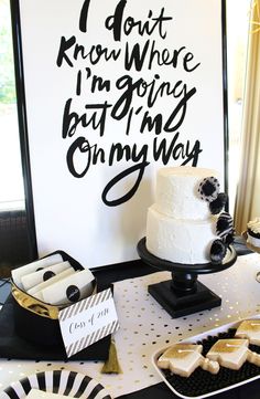 a table topped with cake and cookies next to a sign that says i don't know where i'm going