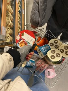 a person is holding food in a basket