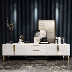 a white and gold sideboard sitting on top of a marble floor next to two vases