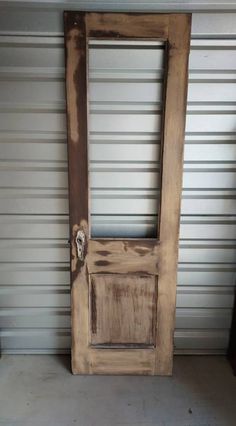 an old wooden door in front of a garage