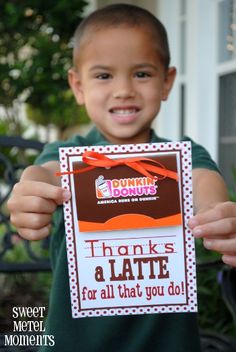 a young boy holding up a sign that says thanks for all that you do