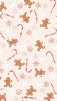 a pink background with gingerbreads and candy canes