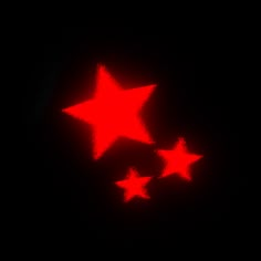 three red stars are glowing in the dark