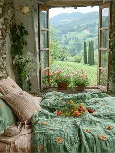 a bedroom with an open window and flowers on the bedspread in front of it