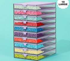 a stacking container filled with lots of different colored sprinkles on top of each other