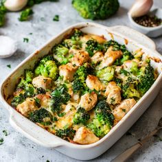 a casserole dish filled with chicken and broccoli