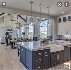 a large kitchen with an island in the middle and lots of counter space around it