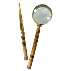 a pair of gold and tortoise shell handled magnifying glasses