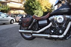 a black and brown motorcycle parked on the street