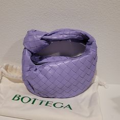 Bottega Veneta Mini Jodie Top Handle Handbag With Single Compartment. Intrecciato Lambskin Leather In Wisteria (Lilac). Made In Italy. Brand New And Never Worn. Comes With Dust Bag And Tags. 11"L X 9"H X 3"W Designer Purple Shoulder Bag With Removable Pouch, Designer Purple Top Handle Shoulder Bag, Luxury Purple Pouch Bag, Luxury Lavender Rectangular Bag, Designer Purple Shoulder Bag, Designer Purple Bags, Mini Jodie, Bottega Veneta Bags, Top Handle Handbags