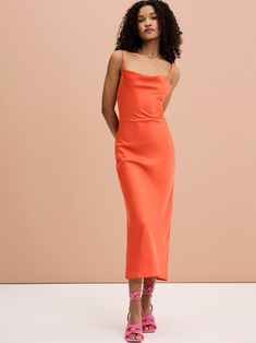 The Riviera in Orange. Featuring a cowl neck with lace up back detailing, in 100% silky soft recycled fabric. Enjoy.