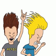 two young men with their hands up in the air and one has his head shaved