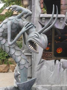 a statue of a dragon with its mouth open