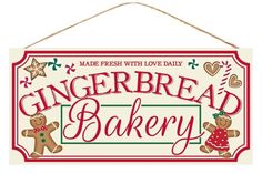 a sign that says gingerbread bakery with two teddy bears hanging from the side of it