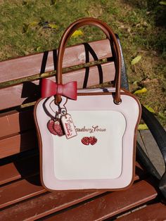 This price is for a bag, a shoulder strap, two detachable bowknots, strawberry heart charm only. This version bag without a see -through window, the interior is two layers like the ita bag version, but it has no insert and buckle inside. Bag Details:Divided Interior / Optional Shoulder Strap / Zip ClosureFabric:PU Size Free Size Height 30 Width 32 Depth 11 Hipster School Outfits, Japanese Handbag, Strawberry Heart, My Style Bags, Ita Bag, Bratz Inspired Outfits, Diy Bag Designs, Cute Backpacks, Pretty Bags