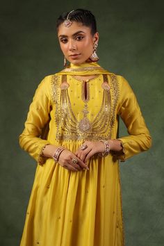 Yellow kurta with sequin, zardozi embroidery on neckline, sleeves and buttis spread all over in floral pattern. Paired with pant and dupatta. - Aza Fashions Gold Embellished Kurta For Festivals, Gold Embellished Kurta For Diwali, Gold Embellished Kurta For Reception, Diwali Gold Embellished Kurta, Dola Silk Kurta With Mirror Work For Reception, Reception Dola Silk Kurta With Mirror Work, Gold Embellished Straight Kurta Set, Embellished Gold Kurta Saree, Bollywood Style Embellished Raw Silk Palazzo Set