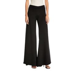 These Pants Are So Chic. The Cut And Silhouette Are Truly Striking In All The Right Ways. The Focal Point Is The Extra-Wide Bottoms Measuring ~25” (Flat). The Rest Of The Design Is Flatteringly Sleek And Simple - Flat Front, High Rise, No Pockets, Side Zip. The Chiffon-Like Poly Fabric Has A Nice Heft: Lightweight, But With Enough Structure To Allow The Pants To Move And Drape Beautifully. Unlined. These Pants Will Be So Fun To Wear! Suitable For All Seasons. Waist (Flat) Measures ~ 17”. Front R Chic Wide Leg Elastane Pants For Party, Fitted Wide Leg Pants For Going Out, Versatile Black Bottoms For Evening, Versatile Black Pants For Evening, Fitted Wide-leg Pantsuit For Night Out, Fitted Wide-leg Pants For Night Out, Versatile Black Evening Bottoms, Versatile Black Evening Pants, Chic Full-length Evening Pants