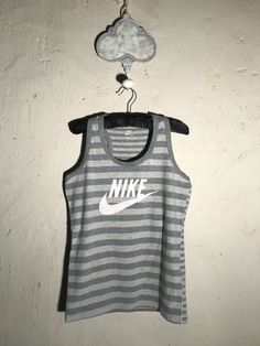 Nike Vest Classic Nike vest perfect for the spring work out regime. Size Medium. Very good condition. Measures from collar seam down the back : 57cm Nike Vest, Spring Work, Vest Outfits, May 11, Work Out, Gender Neutral, Parfait, Bathing Beauties, Adult Outfits