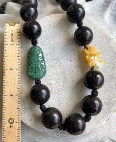 Carved Green Jade Shou Bead Yellow Jade Bat Nut Seed Bead Vintage Necklace beautifully hand knotted measures 20 inches around Weighs 89 Grams Artisan Hand Knotted Beaded Necklaces With Round Beads, Artisan Hand Knotted Beaded Necklace With Round Beads, Artisan Hand Knotted Beaded Necklaces, Artisan Hand-knotted Beaded Necklace With Round Beads, Traditional Hand Knotted Necklaces With Round Beads, Traditional Hand-knotted Necklaces With Round Beads, Traditional Hand Knotted Round Bead Necklaces, Black Hand-knotted Jewelry With Round Beads, Usa Jewelry