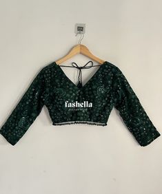 Stunning emerald green/ dark green blouse.  It has thread and transparent sequin embroidery on net fabric. This blouse is a versatile piece and can be paired with saris and lehengas.  DEATILS * V neck font and back * 3/4 th sleeves * Padded * Back hooks for closure This blouse can be made in ANY color. Please send me a convo if you need it in a different color.  MEAUREMENTS & CUSTOMIZATIONS This blouse can be purchased in your standard sizing and pattern. Please choose your Chest Size (measured in inches) from the drop-down box.  For custom sizing please include the below measurements in the the notes to whenever you placed the order.  * Chest size: * Waist size: * Blouse Length: * Sleeve Length: * Bicep: * Arm-hole: * Front Neck Depth: * Back-Neck Depth:  SHIPPING DETAILS  Please leave yo Dark Green Embroidery Blouse, Festive Green Choli With Unstitched Blouse, Festive Green Unstitched Blouse Choli, Green Anarkali Choli With Unstitched Blouse, Fitted Green Saree Choli, Green Unstitched Blouse Choli For Festivals, Green Choli With Unstitched Blouse For Navratri, Green Embroidered V-neck Blouse, Semi-stitched Green Choli For Party