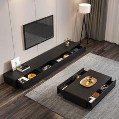 two black tables with trays on them in front of a flat screen tv mounted to the wall