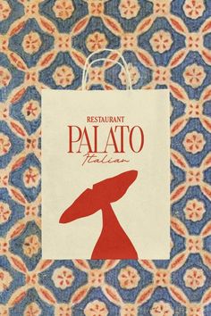 a paper bag with the word restaurant palato written in red and blue on it