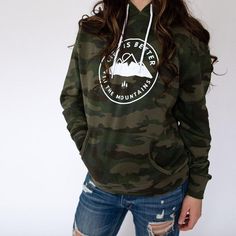 Feel The Warmth... This hoodie is a unisex fit with drawstring hood and front pockets. Super Soft "Life is Better in the Mountains" Hoodie Camouflage Color Designed and hand printed in Montana with white ink. Polyester and Cotton Blend Office Wear Winter, Cute Camo Outfits, Snow Camouflage, Outfit Ideas Edgy, Living In The Mountains, Camouflage Hoodie, Camo Dress, Camouflage Colors, Camo Outfits