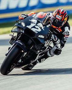 a person riding a motorcycle on a race track