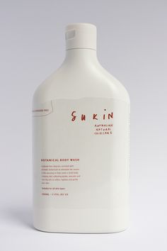 a bottle of skin lotion on a white background with the label in red writing