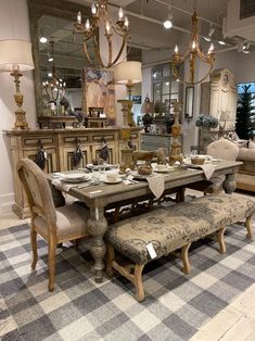 a dining room table and chairs in a store