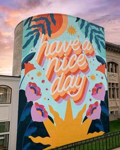 a large mural on the side of a building that says, have a nice day