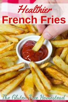 french fries on a plate with ketchup in a small bowl and the words, my try at healthier french fries