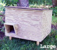 a dog house built into the side of a tree