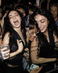 group of women laughing and holding cell phones in their hands