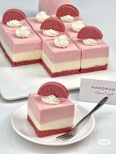 there are many desserts on the plate and one is pink with white frosting