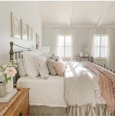 an instagramted photo of a bed in a bedroom with white walls and wood floors