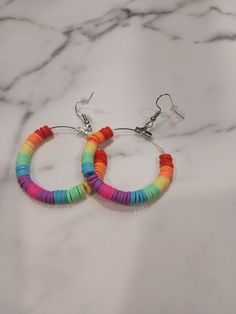 Rainbow clay disc make up this beautiful earring set. Great for any occasion. Jewelry Earrings Hoops, Beautiful Earrings, Earring Set, Etsy Earrings, Make Up, Hoop Earrings, Jewelry Earrings, Rainbow